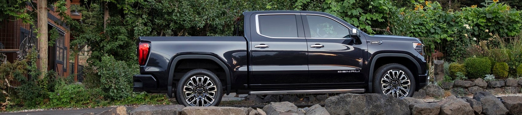 GMC Denali parked next to house